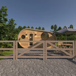 Front exterior view of The Grotto Pod showing timber cladding, entrance door, and circular windows.