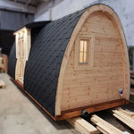 Angled side view highlighting the curved profile and insulated shingle roof of the Hearthwood Pod 5 Person Glamping Pod with disabled access