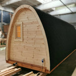 Right-side exterior view of the Hearthwood Pod 5 Person Glamping Pod with disabled access, showcasing curved roof and accessible design