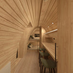 Interior view showing dining table and double bunk bed in the Hearthwood Pod 5 Person Glamping Pod with disabled access