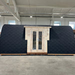 Luxury Hearthwood pod exterior front view showing double entrance doors and curved insulated roof