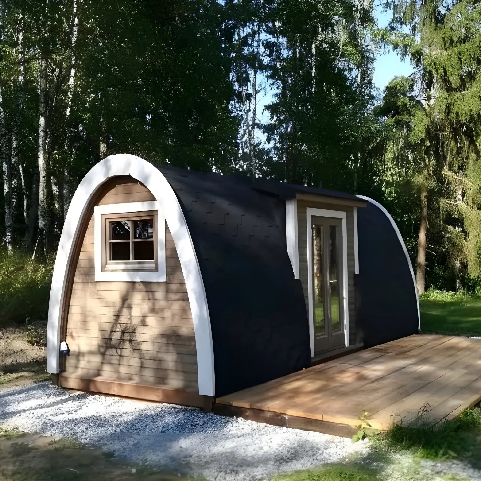 Side exterior view of the Hearthwood luxury 2–4 person glamping pod in a landscaped outdoor setting