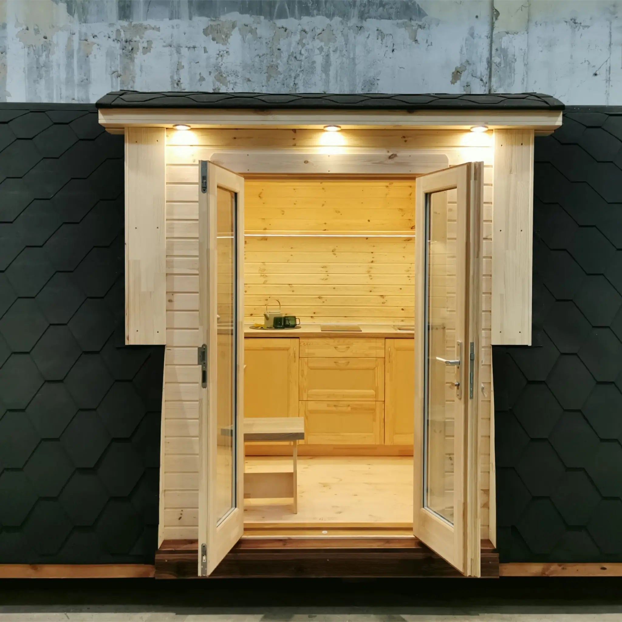 Front close-up view of The Hearthwood Pod luxury glamping pod highlighting double glass doors and modern finish