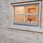 Exterior rear window view of the Hearthwood luxury 6 person glamping pod with natural wood finish