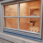 Rear window detail on the Hearthwood luxury 6 person glamping pod showing timber construction