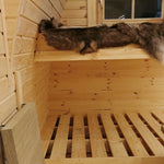 Close-up of upper bunk bed with natural timber finish inside The Hearthwood Pod