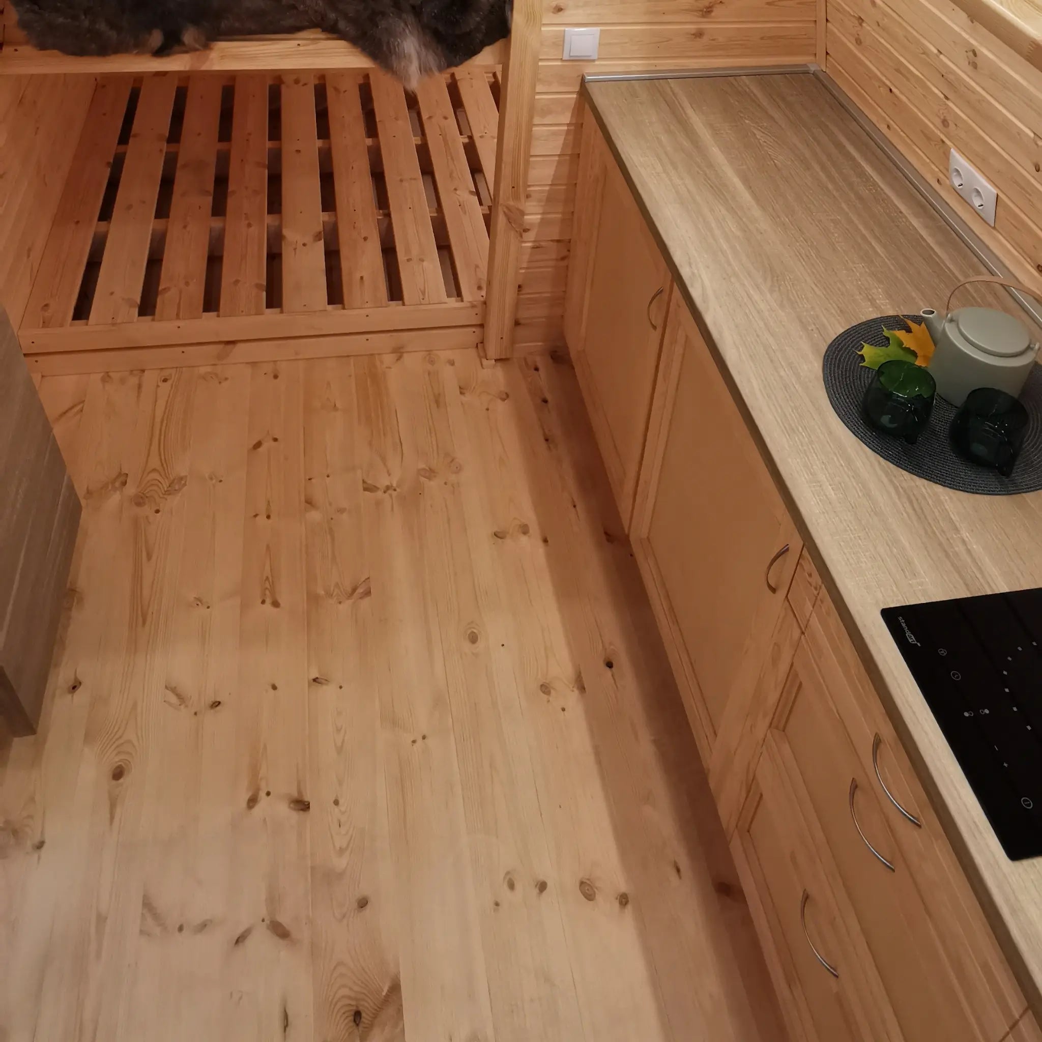 Kitchen counter and timber flooring inside The Hearthwood luxury glamping pod