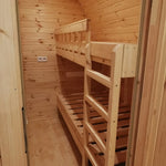 Interior bedroom with wooden bunk bed inside The Hearthwood Pod luxury 6 person glamping accommodation