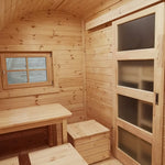 Dining area and bunk bed with sliding wooden door inside The Hearthwood Pod luxury 6 person glamping pod
