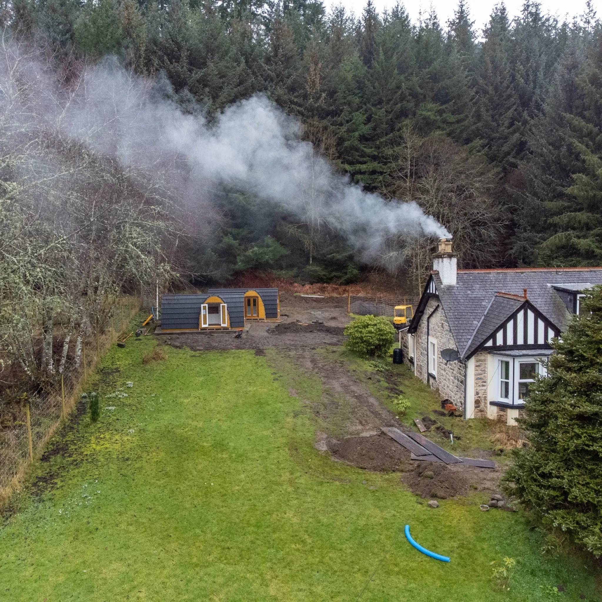 Aerial View of Hobbit Pod Glamping Cabins in Forest Resort Setting