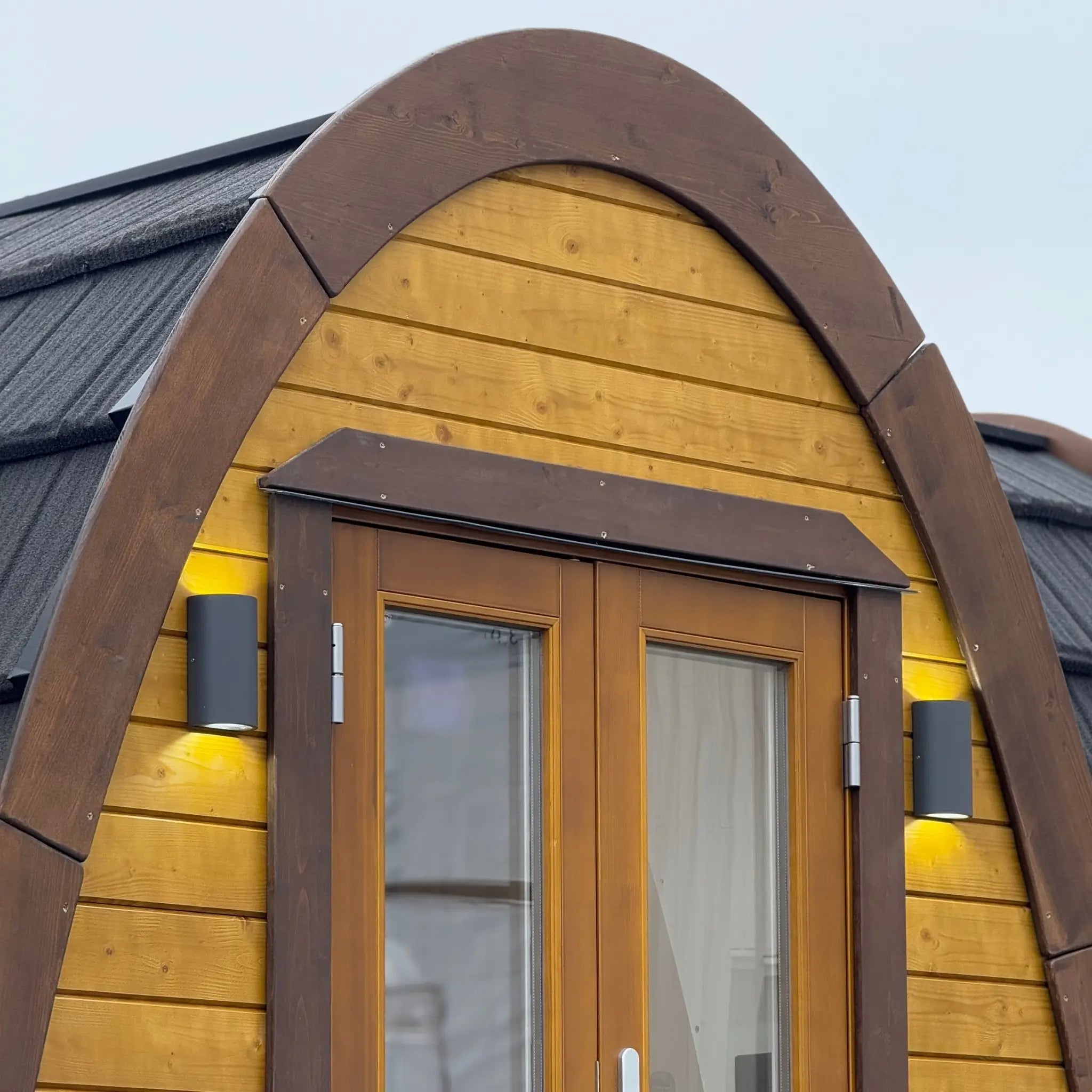 Exterior Wall Lights and Timber Entrance of Hobbit Glamping Pod