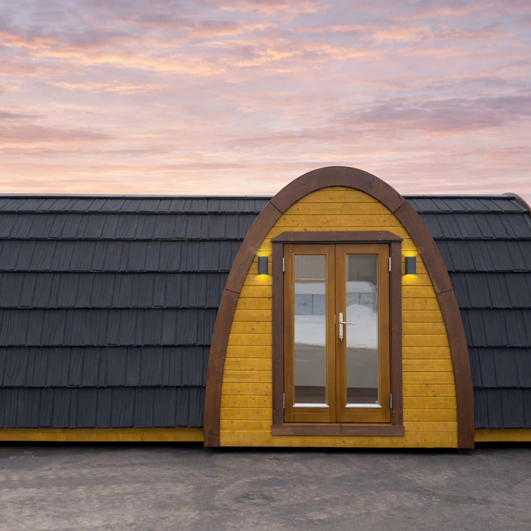 Curved Timber Hobbit Pod Exterior with Panoramic Glass Entrance