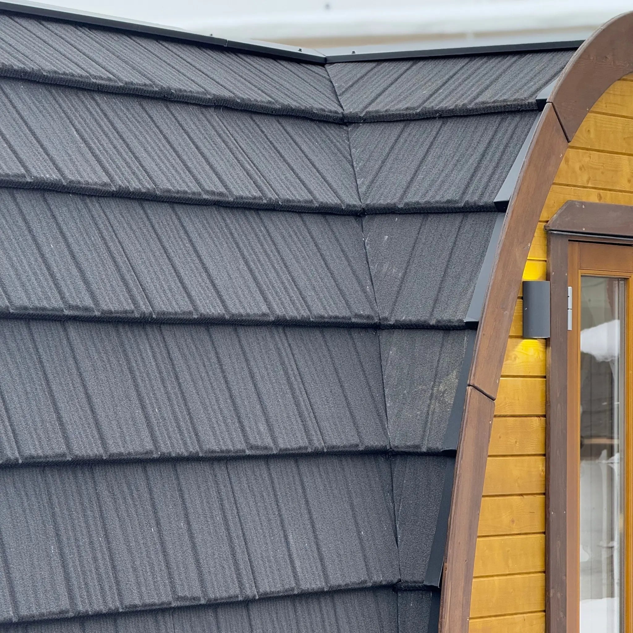 Close Up of Dark Roof Shingles on Curved Hobbit Pod Roof
