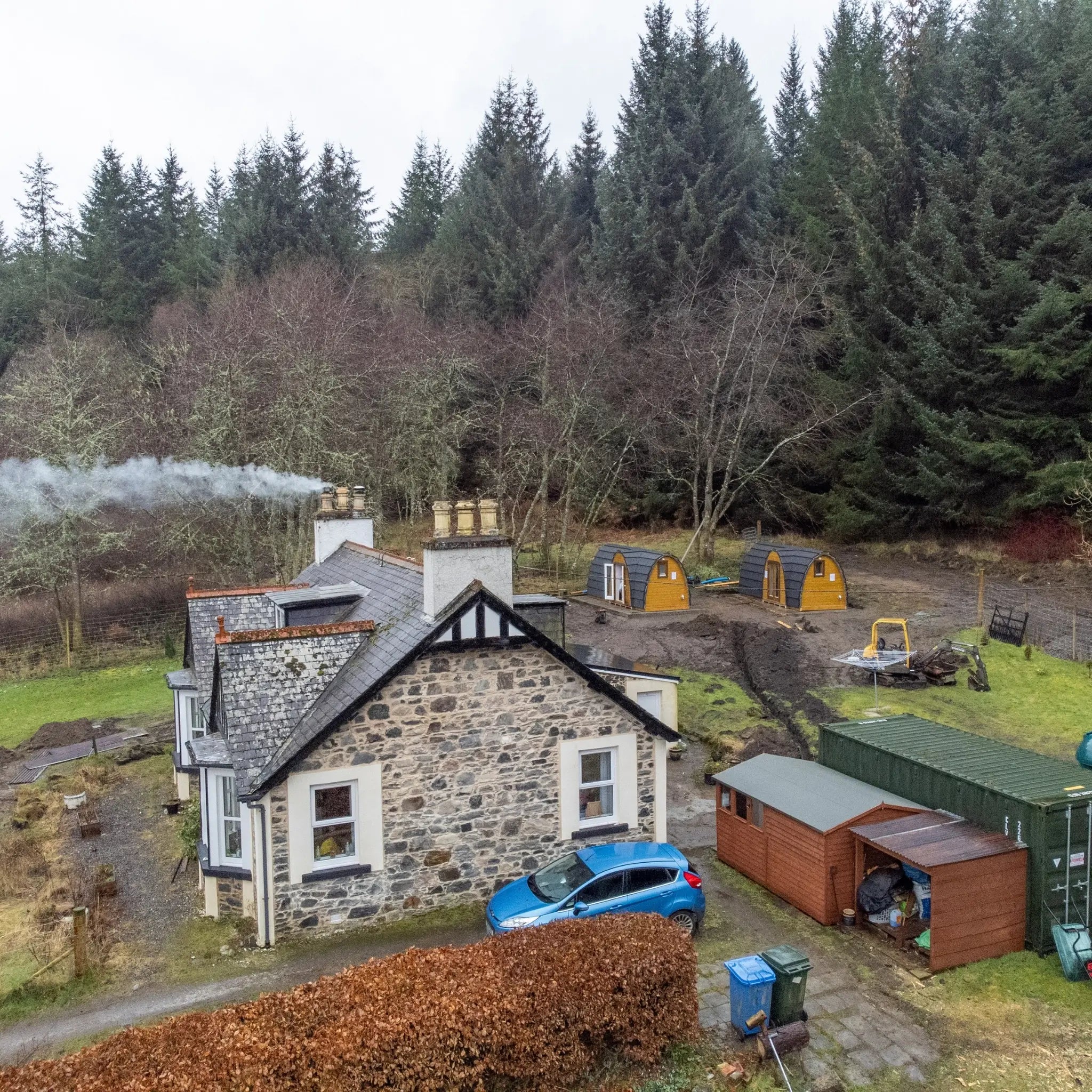 Aerial View of Hobbit Pod Glamping Cabins in Forest Resort Setting