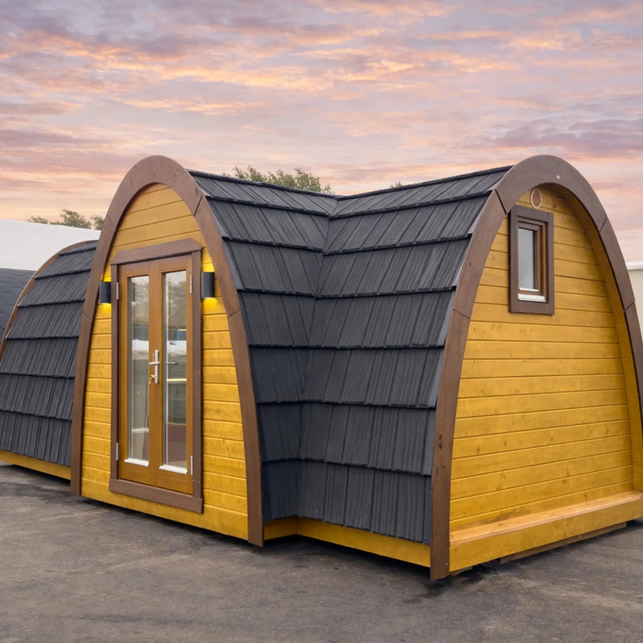 Side View of Hobbit Pod Showing Curved Roof and Timber Cladding