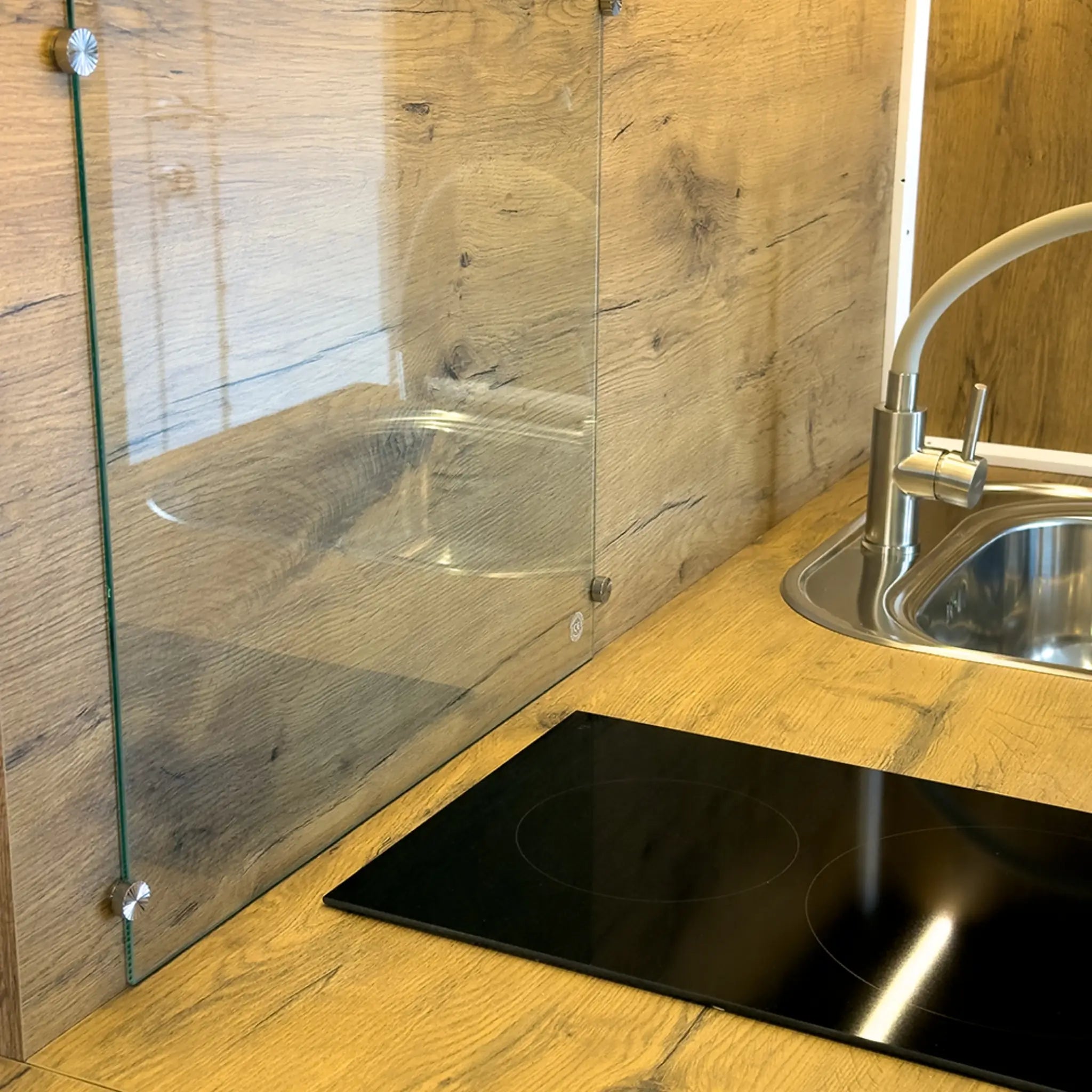 Glass Splashback and Induction Hob in Compact Pod Kitchen