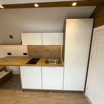 Hobbit Pod Exterior Window Detail with Timber Cladding and Curved Roof