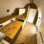 Full Interior View of Hobbit Pod Kitchen and Living Area