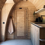 Kitchenette with integrated storage inside The Hobbit Pod luxury glamping pod