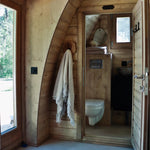 View towards the ensuite bathroom from inside The Hobbit Pod luxury glamping pod