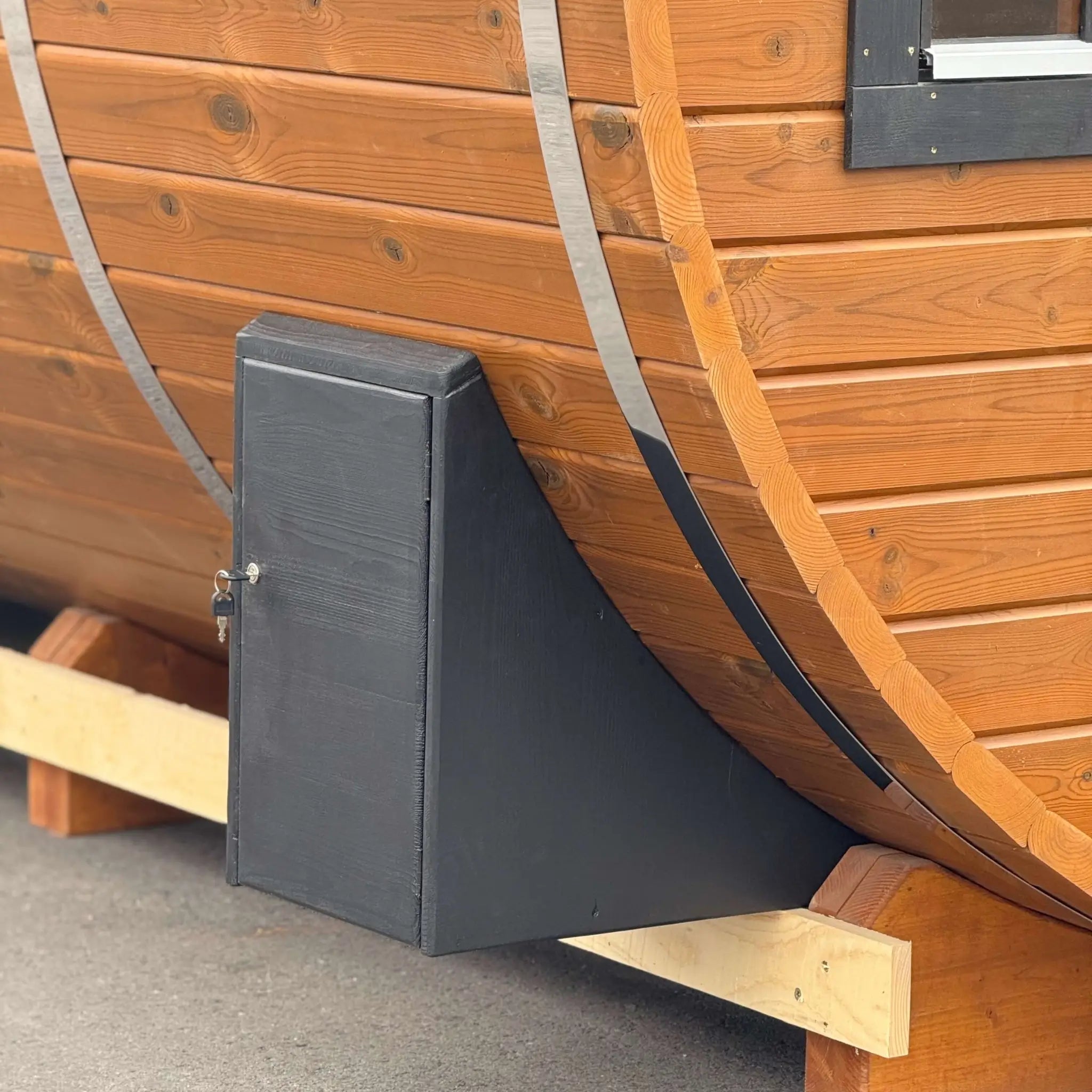 External electrical connection box on the Infinity Glass luxury barrel sauna