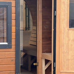 View from the entrance into the changing room and sauna room inside the Infinity Glass barrel sauna