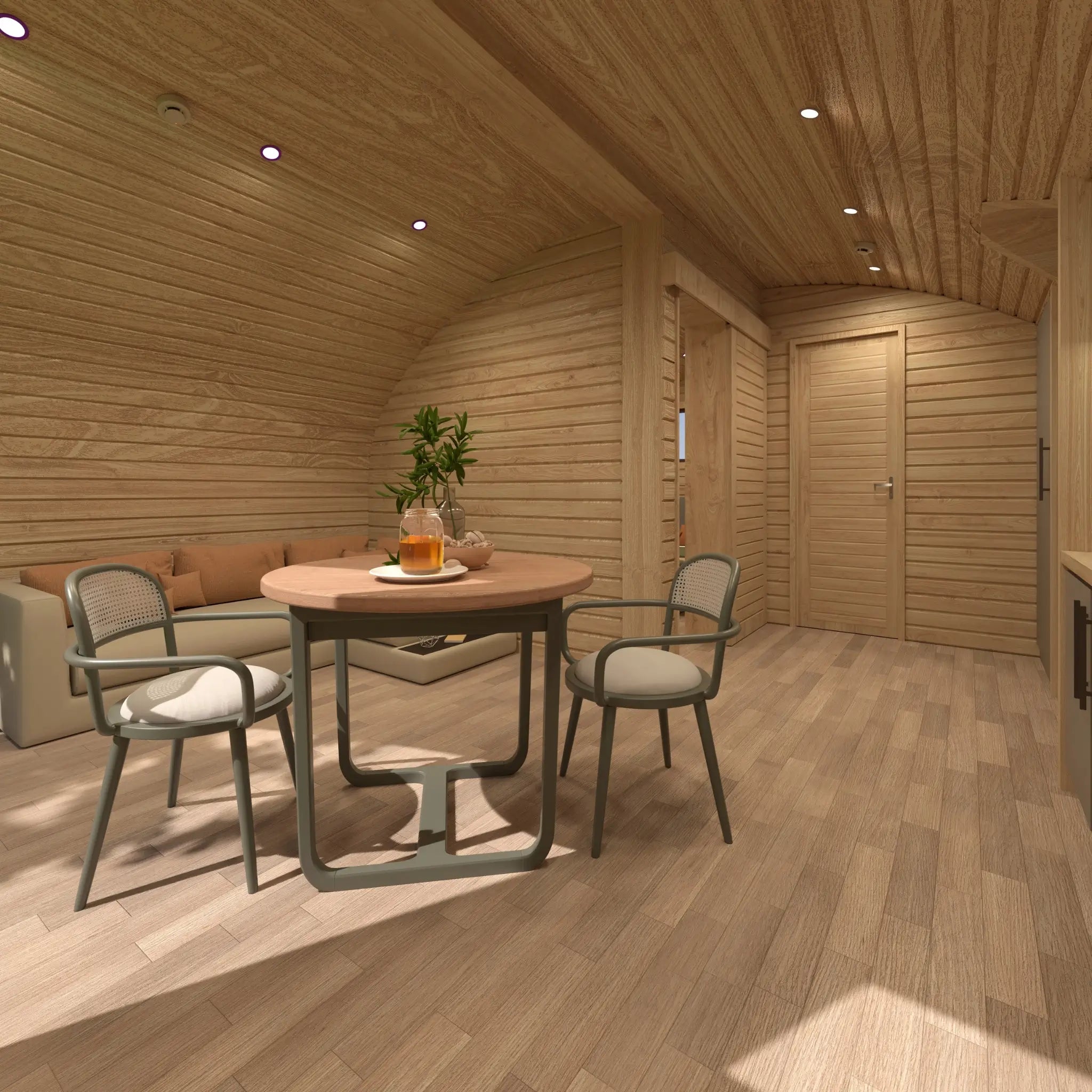 Interior dining area of the Moonburrow Pod, a luxury 2-person glamping pod with a modern table setup, curved wooden walls, and cozy seating.