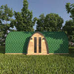 Front view of the Moonburrow Pod, a luxury 2-person glamping pod featuring a curved green roof, timber exterior, and welcoming double entrance doors.