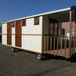 Contemporary washroom hut exterior with timber-style finish and private entrance decking