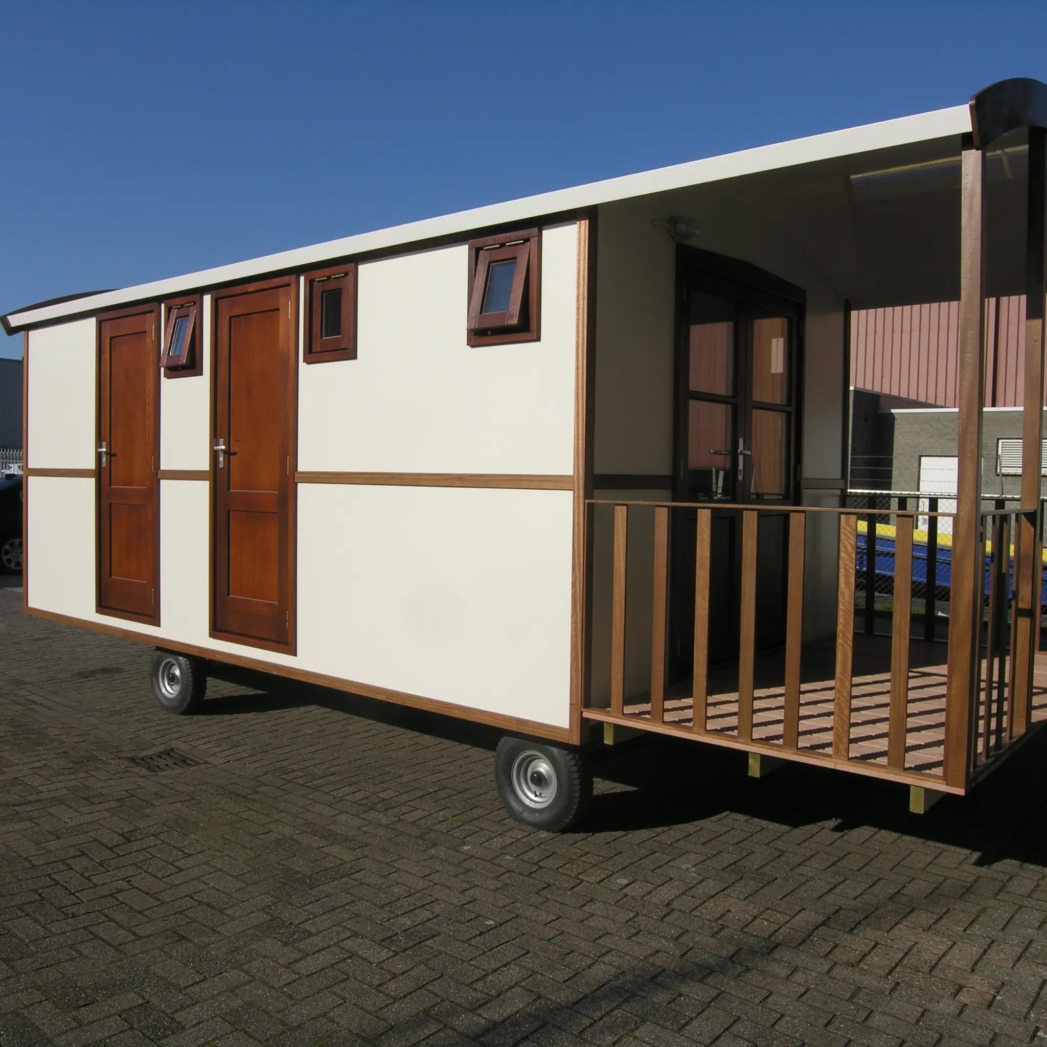 Contemporary washroom hut exterior with timber-style finish and private entrance decking