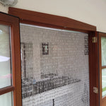Decorative beaded privacy curtain entrance inside luxury washroom shepherds hut