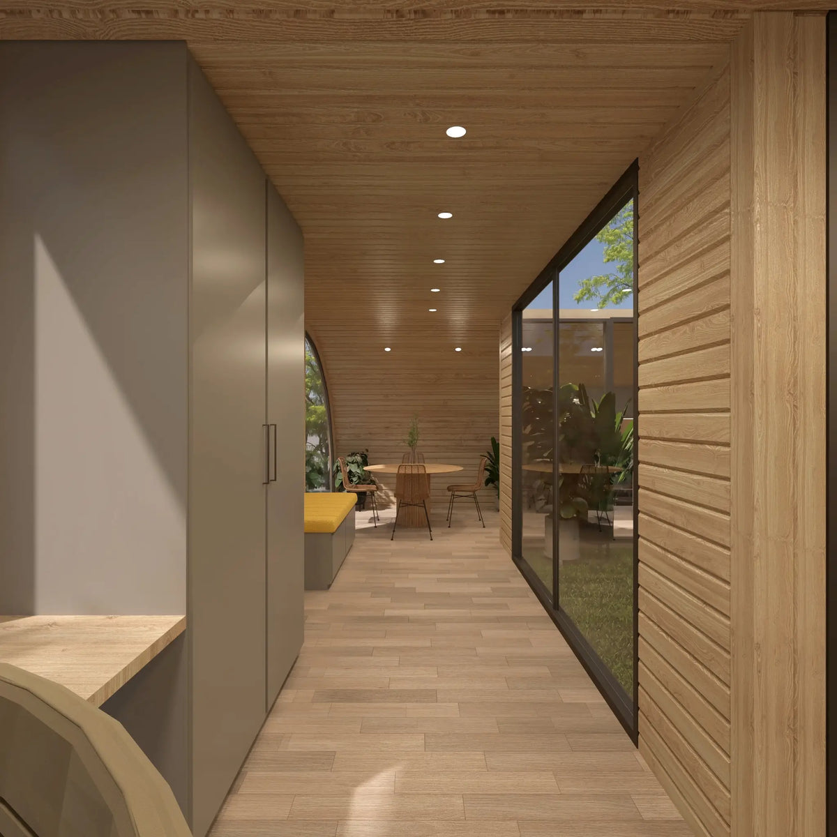 Interior walkway with built-in coat storage and bench leading towards the dining area beside the glazed central courtyard of the ultimate 2 person glamping pod.