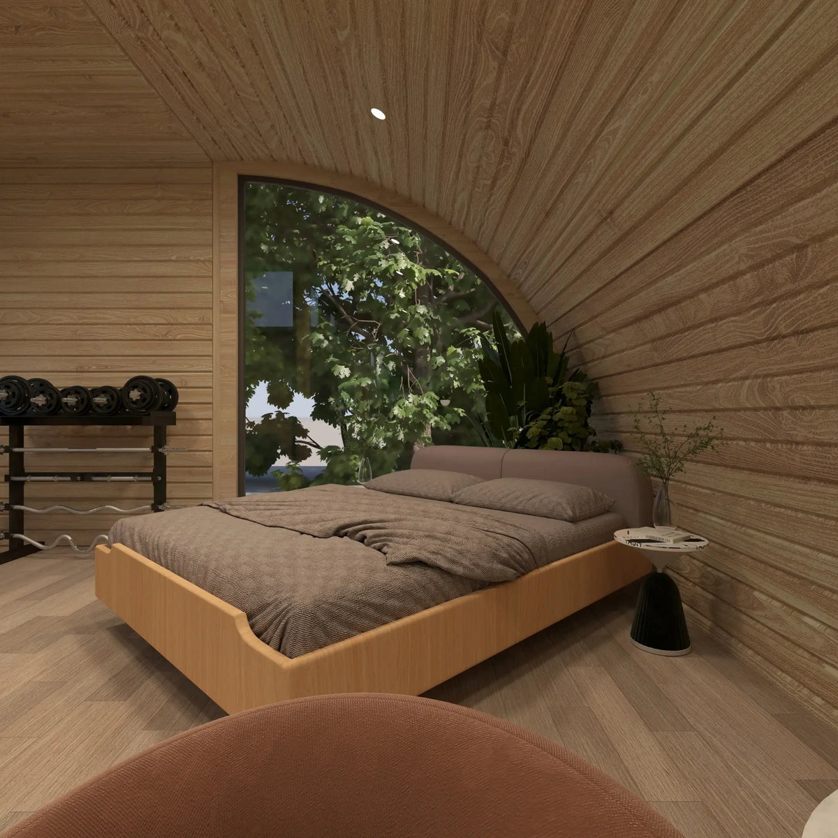Bedroom inside the ultimate 2 person glamping pod with double bed, timber interior and large curved panoramic window overlooking the surrounding landscape.