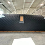 Back view of The Twilight Pod luxury glamping pod with integrated VELUX roof window and curved timber structure