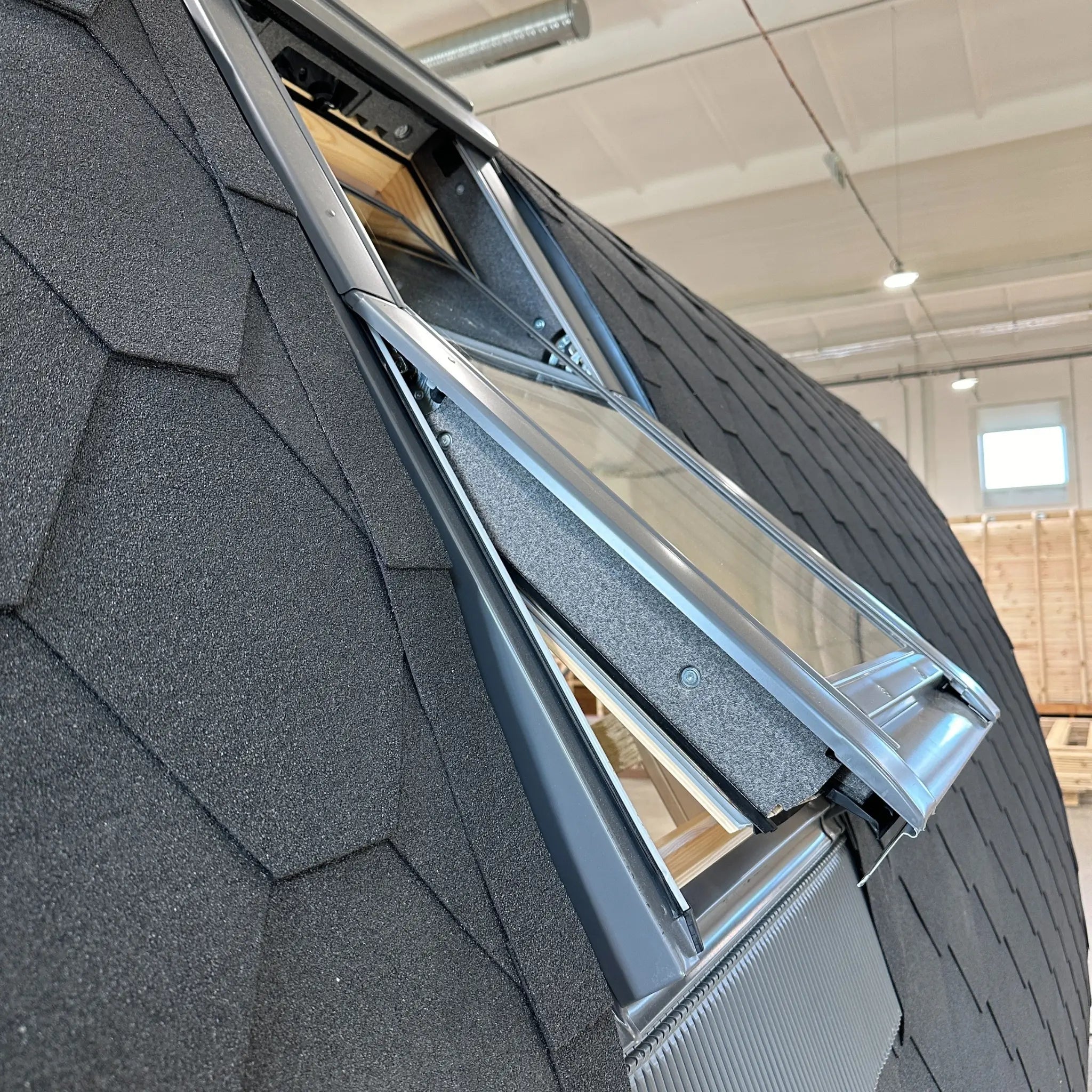 Detailed side angle of open VELUX roof window on The Twilight Pod luxury glamping pod roof