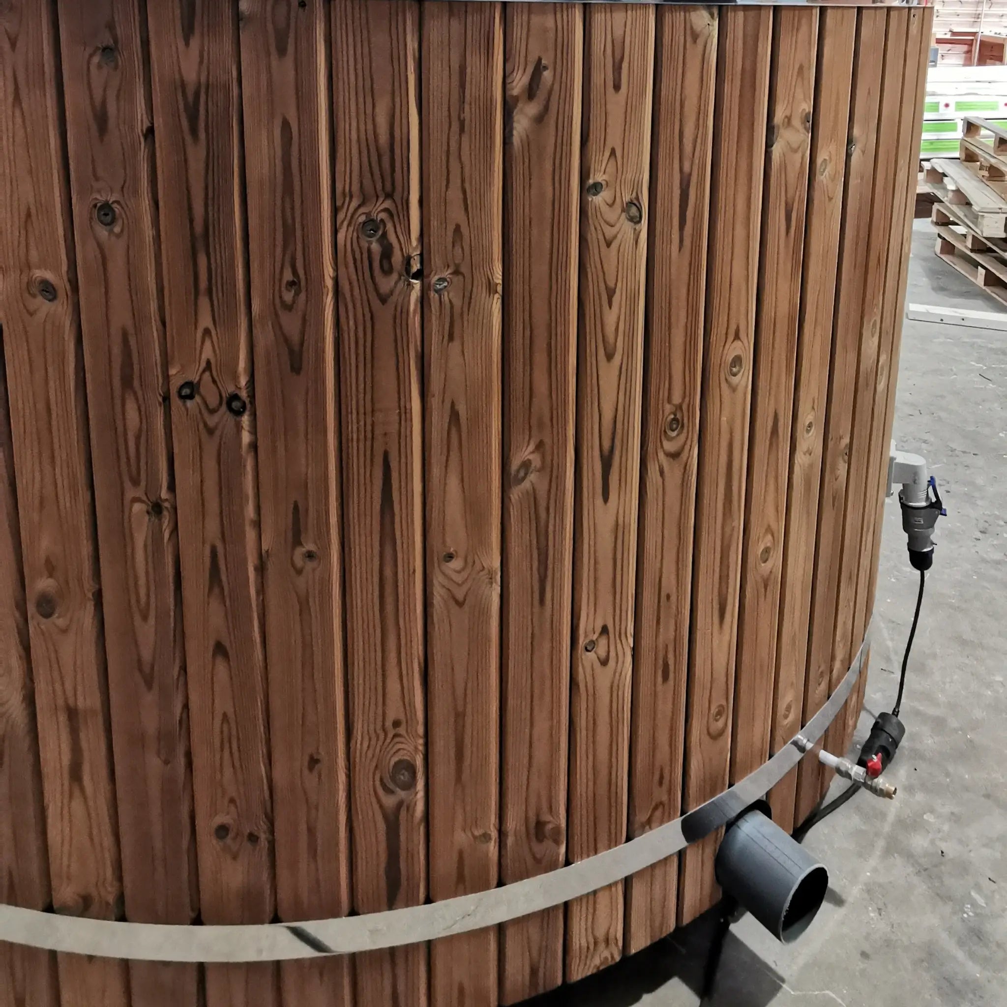 External electrical commando socket installed on the curved timber wall of The Washwood Barrel.