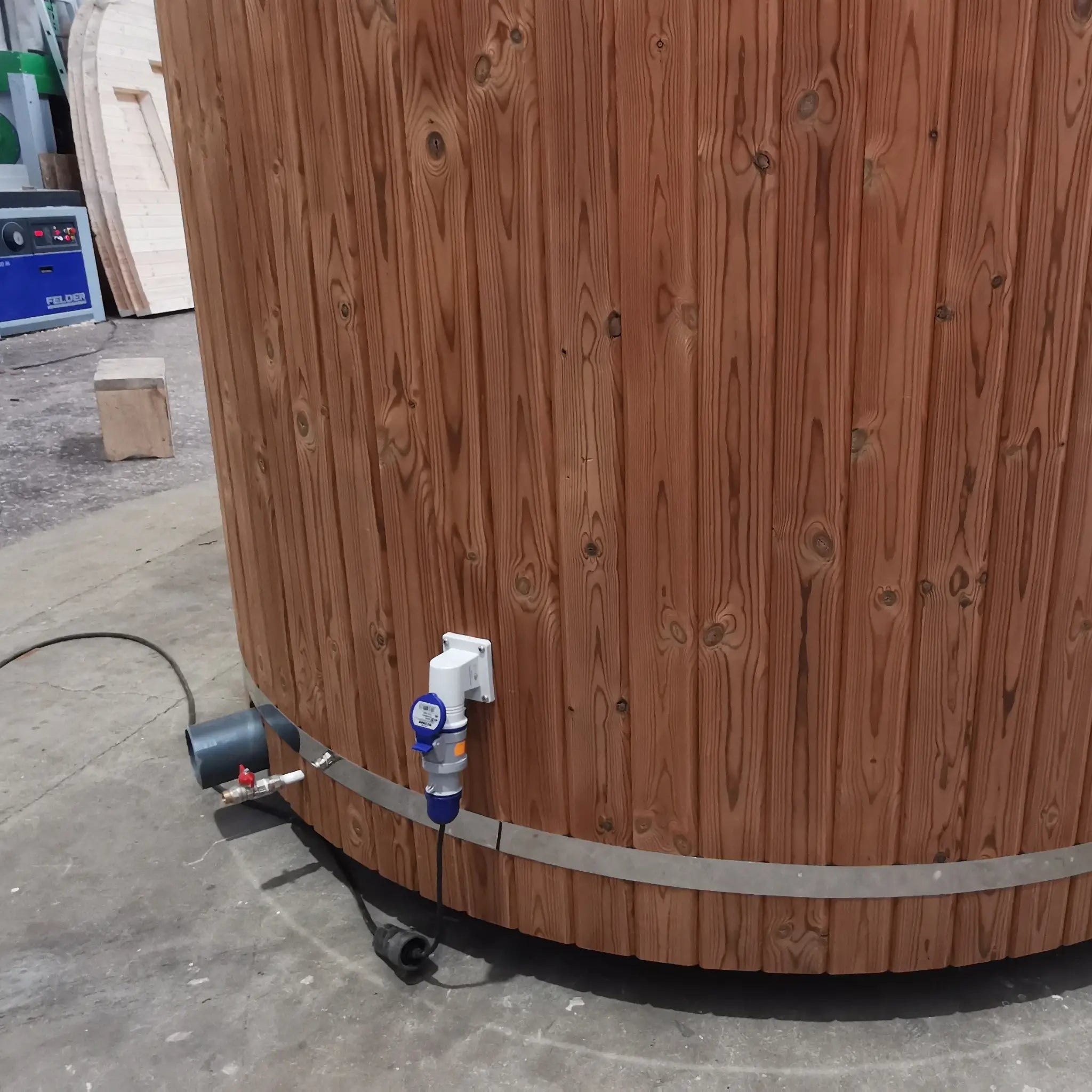 Detail view of exterior power connection and cabling on The Washwood Barrel.