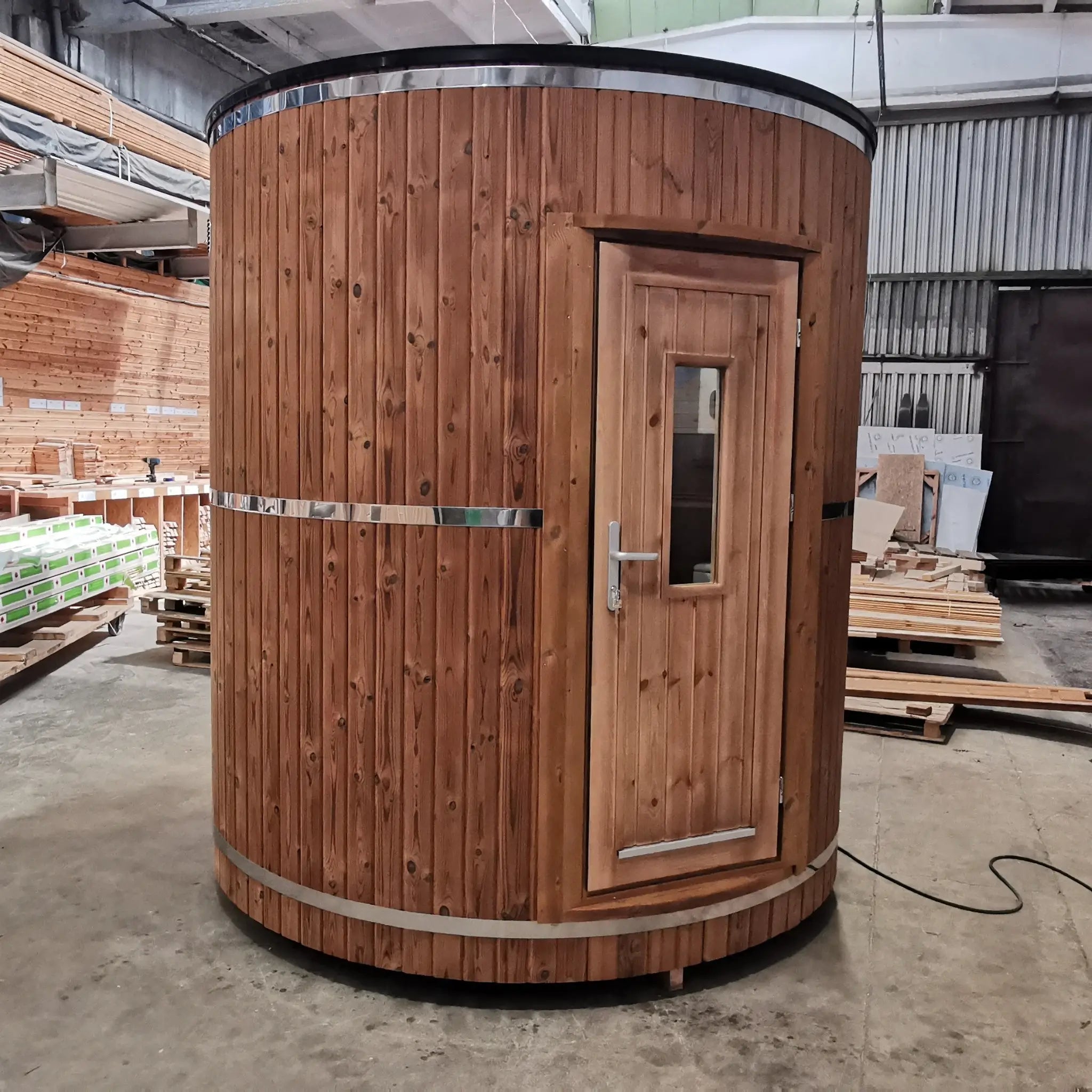 Exterior front view of the Washwood Barrel with timber cladding and single entry door