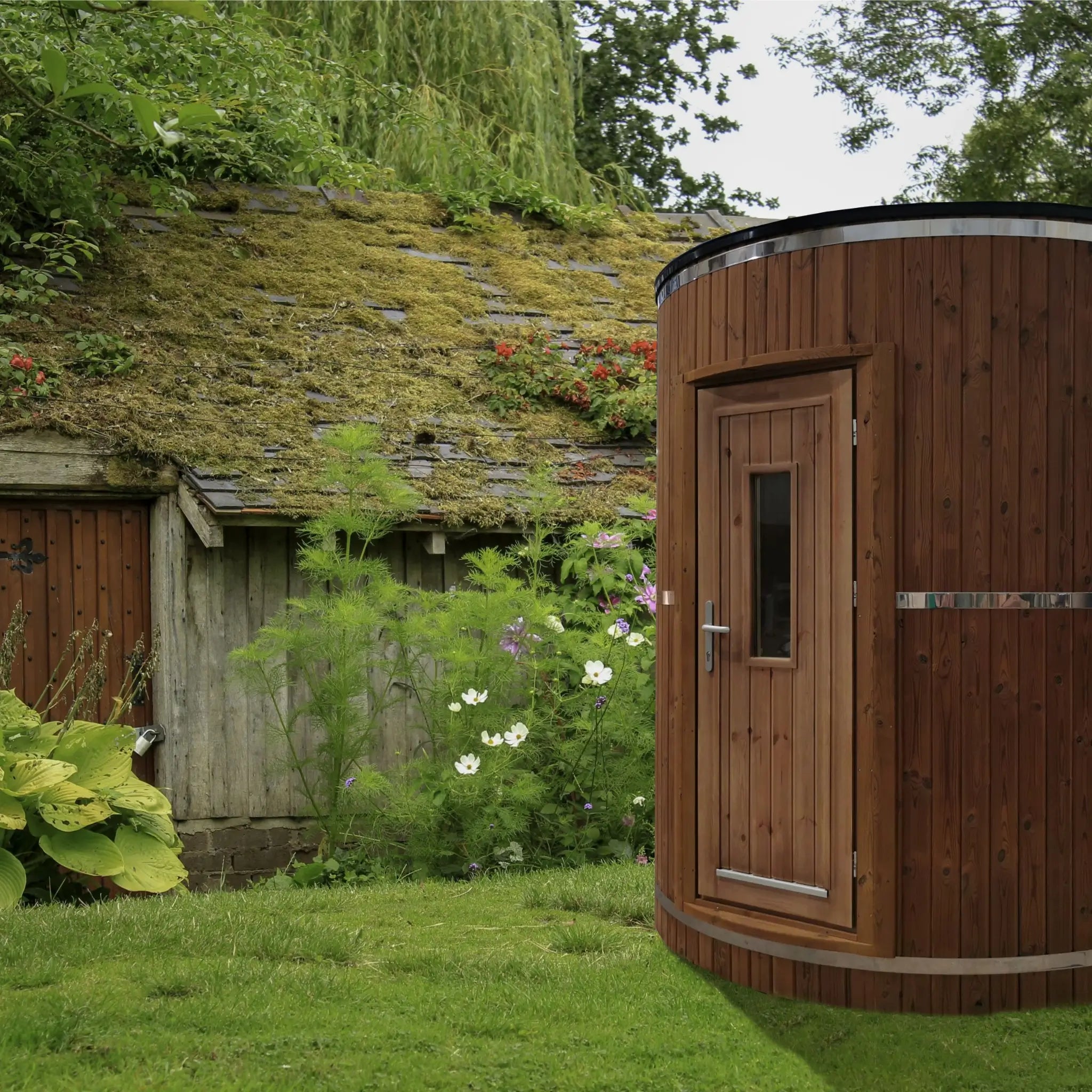 Washwood Barrel installed in a garden setting beside a moss-covered outbuilding