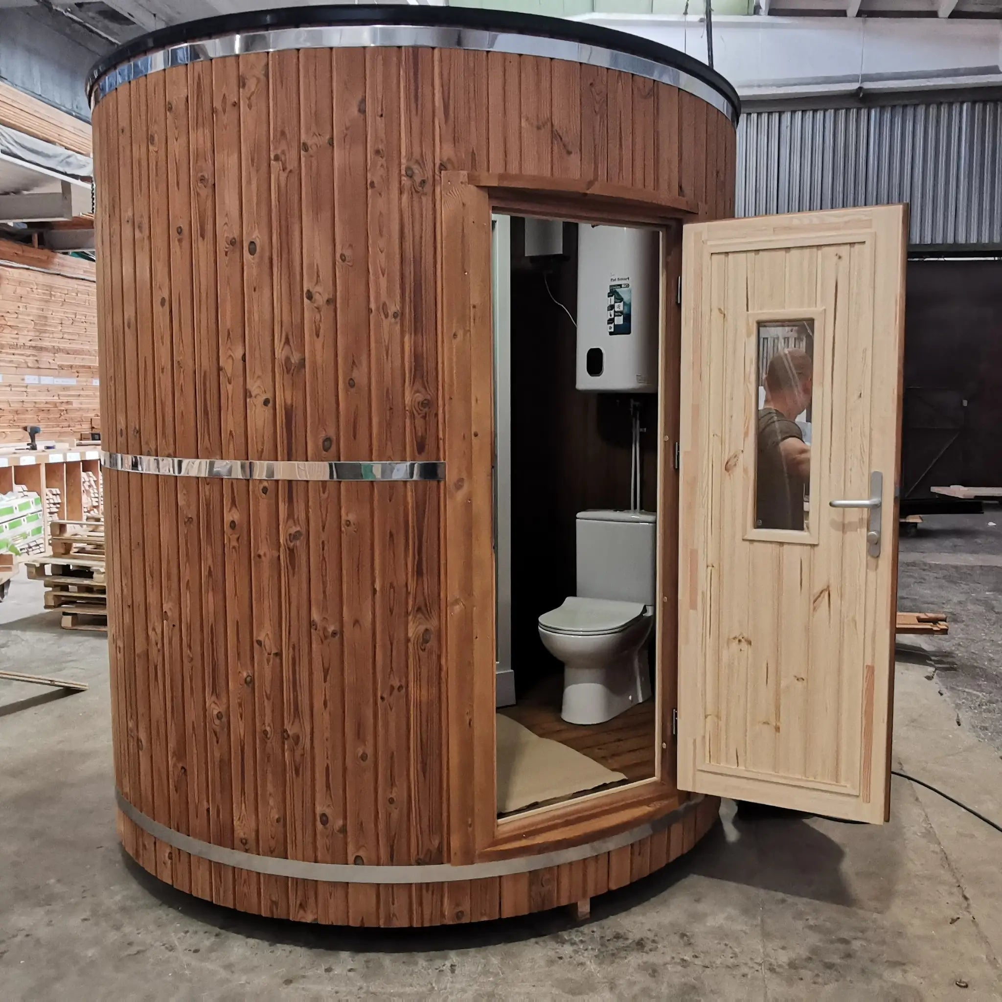 Exterior view of the Washwood Barrel with door open revealing internal WC layout