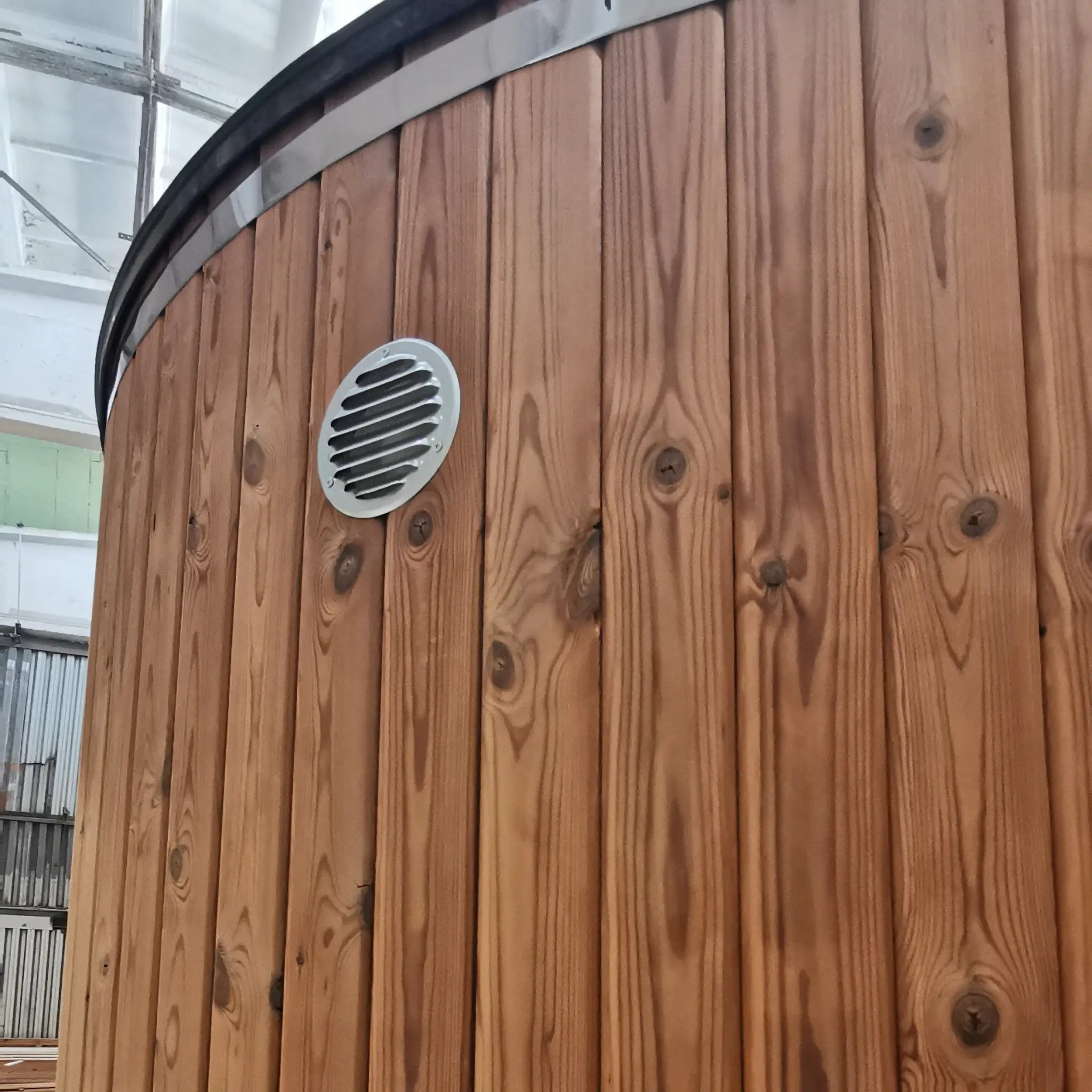 Close-up of Washwood Barrel exterior ventilation grille set into timber cladding