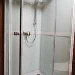 Full shower cubicle view with frosted panels inside the Washwood Barrel