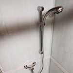 Chrome shower rail and mixer tap inside the Washwood Barrel shower cubicle
