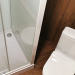 Compact shower and toilet configuration in Washwood Barrel interior
