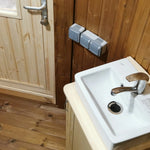 Wall-mounted basin and vanity unit inside the Washwood Barrel bathroom