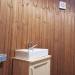 Interior sink area with timber cladding and ventilation fan in Washwood Barrel
