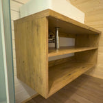 Luxury bathroom vanity unit inside the Dual Halfmoon Pod, featuring oak-effect storage shelves and modern basin