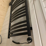 Black electric towel radiator in bathroom of Dual Halfmoon luxury 2 person glamping pod