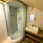 Modern ensuite bathroom with corner shower and vanity in Dual Halfmoon glamping pod