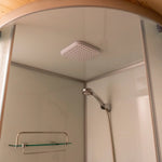 Rainfall shower head inside modern ensuite of Dual Halfmoon glamping pod
